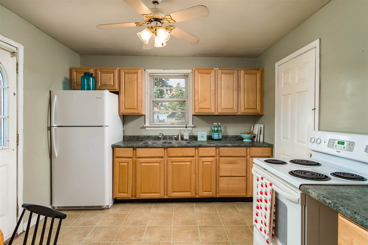 133 Quick's Mill Road Verona, VA 24482 - Photo 6 of 16 a kitchen with stainless steel appliances granite countertop a stove a refrigerator a sink a stove and white cabinets