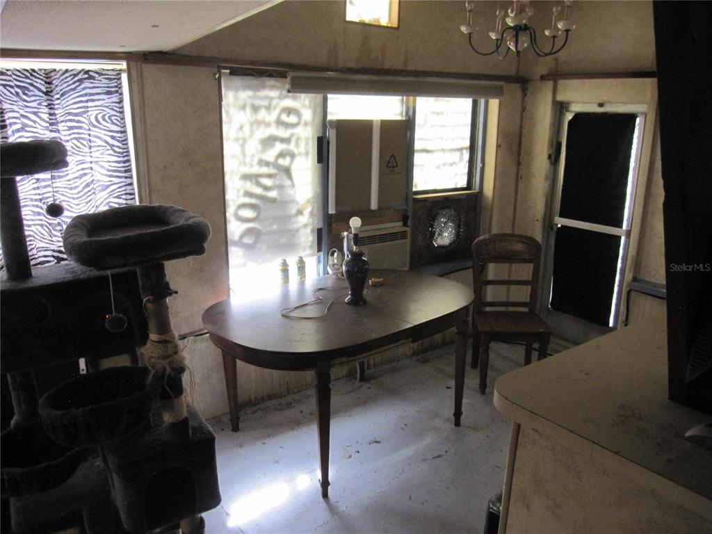 37736 Phelps Road Zephyrhills, FL 33541 - Photo 16 of 30 a view of a dining room with furniture and window
