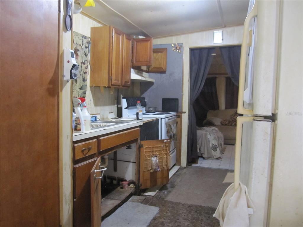 37736 Phelps Road Zephyrhills, FL 33541 - Photo 18 of 30 a utility room with cabinets washer and dryer