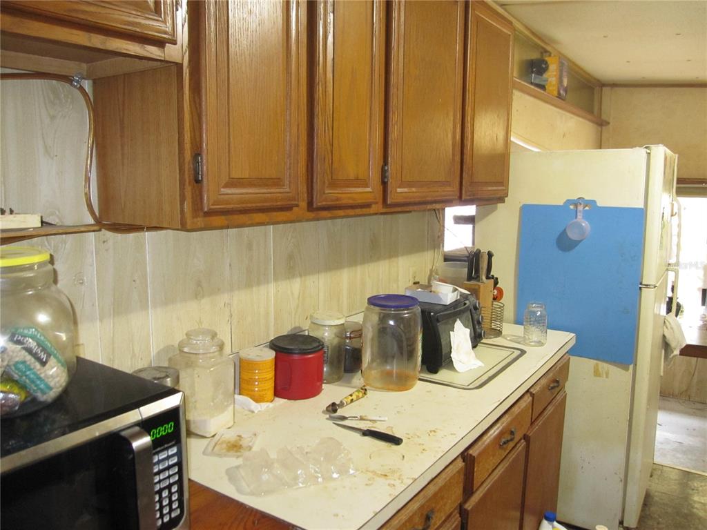 37736 Phelps Road Zephyrhills, FL 33541 - Photo 22 of 30 a kitchen with a sink and cabinets
