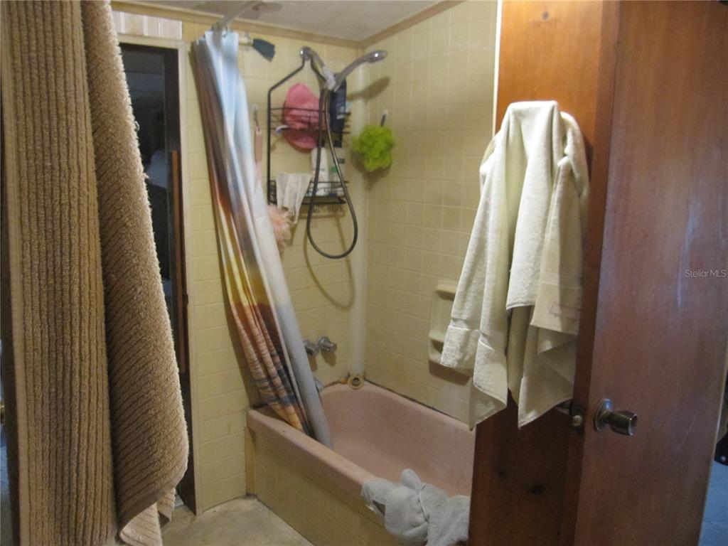 37736 Phelps Road Zephyrhills, FL 33541 - Photo 24 of 30 a bathroom with a bathtub and shower