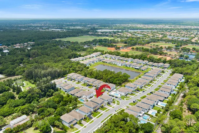 an aerial view of residential houses with outdoor space