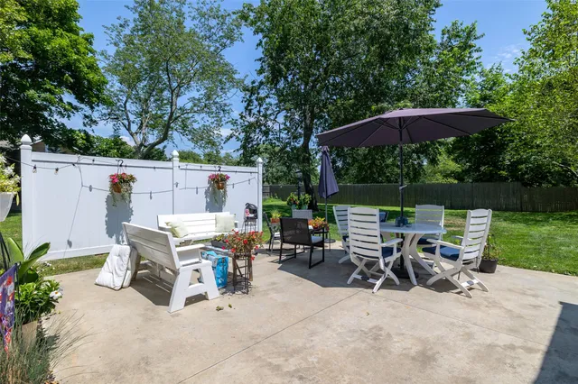 an outdoor space with furniture and umbrella
