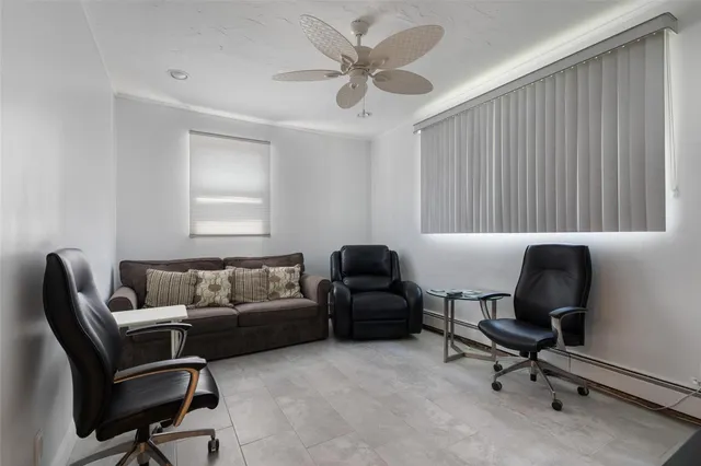 a work room with furniture and a window