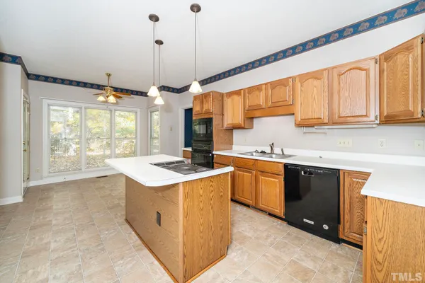 a kitchen with stainless steel appliances granite countertop a stove and a sink