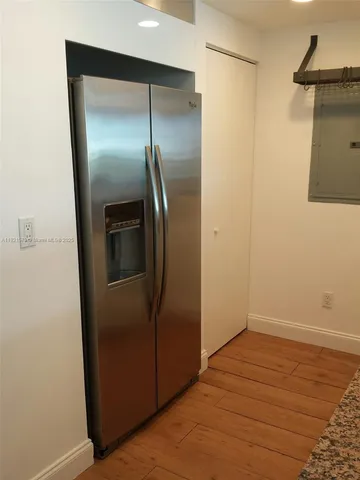 a view of a refrigerator in kitchen and a refrigerator