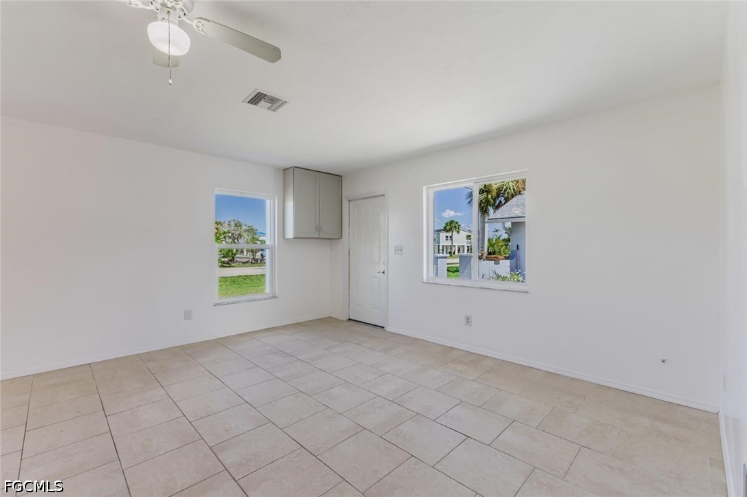 16595 Davis Road Fort Myers, FL 33908 - Photo 8 of 31 an empty room with windows