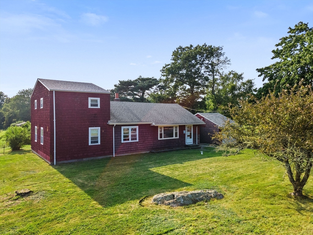 225 Cushman Road Rochester, MA 02770 - Photo 8 of 42 front view of a house with a yard