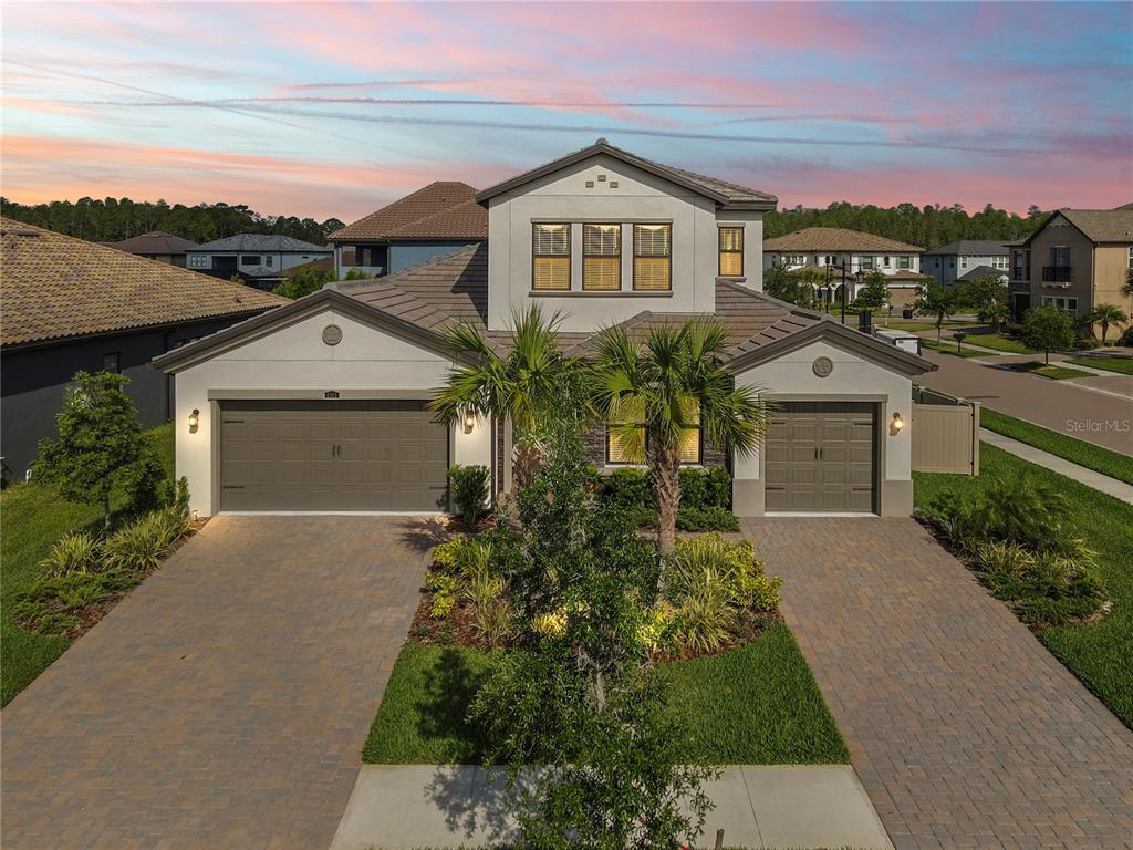 4365 Frontera Lane Wesley Chapel, FL 33543 - Photo 1 of 1 a front view of a house with a yard and garage