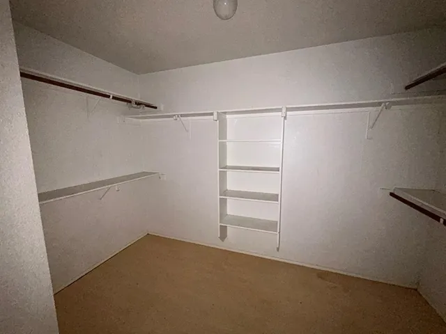 a bathroom with a tub and shower