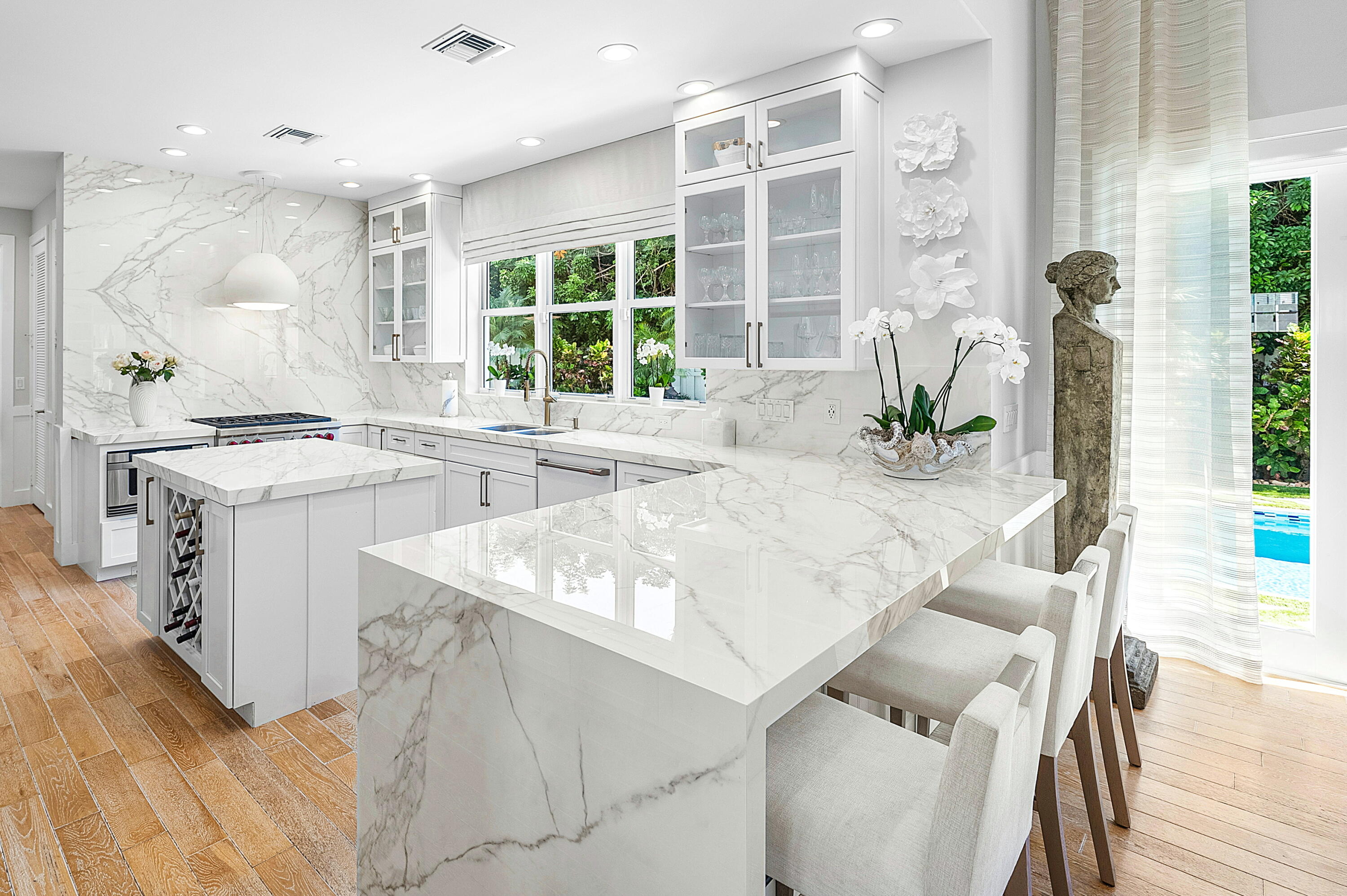 540 Northeast Spanish Trail Boca Raton, FL 33432 - Photo 14 of 47 a kitchen with a sink stove and cabinets