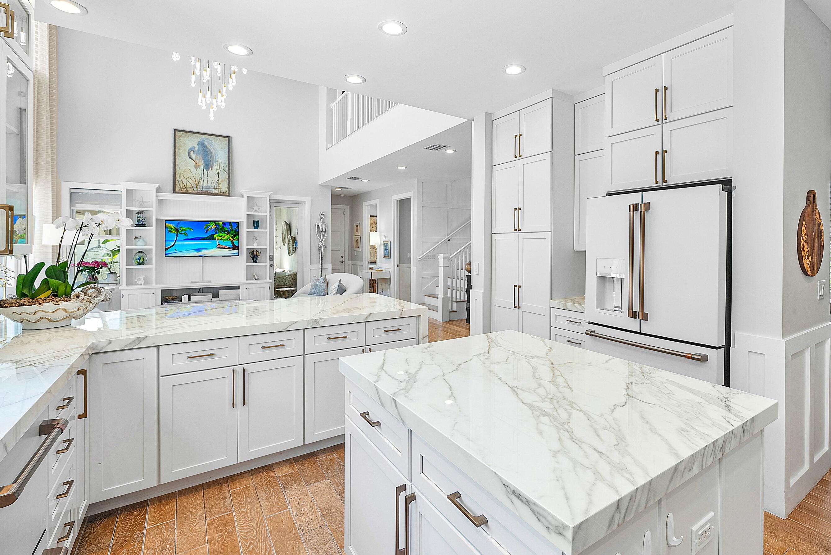 540 Northeast Spanish Trail Boca Raton, FL 33432 - Photo 16 of 47 a large white kitchen with stainless steel appliances granite countertop a sink stove and refrigerator