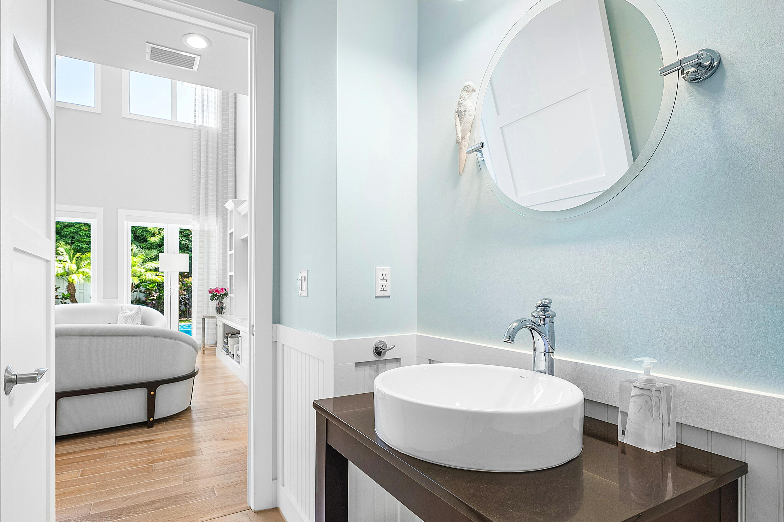 540 Northeast Spanish Trail Boca Raton, FL 33432 - Photo 19 of 47 a en suite bathroom with a sink and a mirror