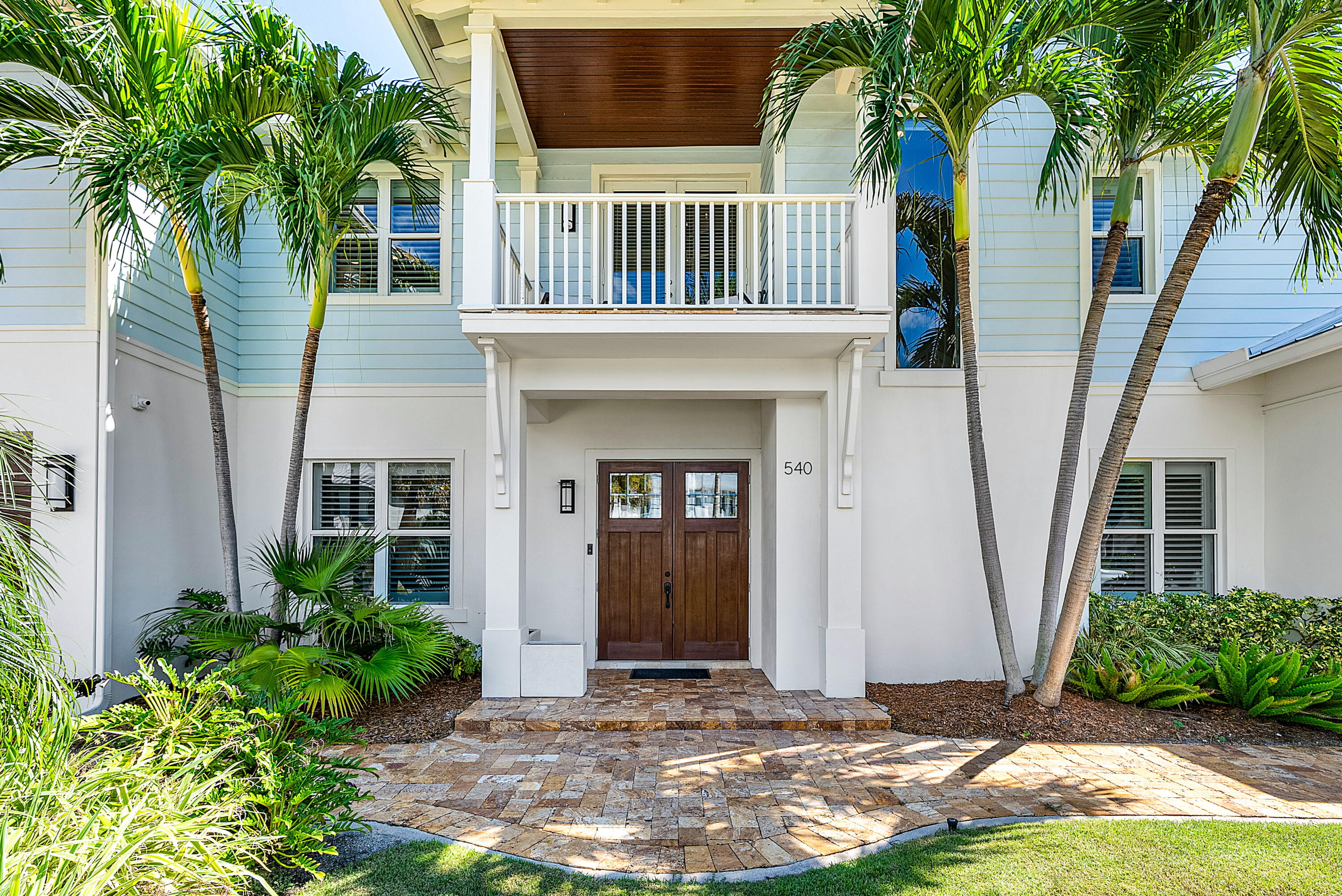 540 Northeast Spanish Trail Boca Raton, FL 33432 - Photo 2 of 47 a front view of a house with garden