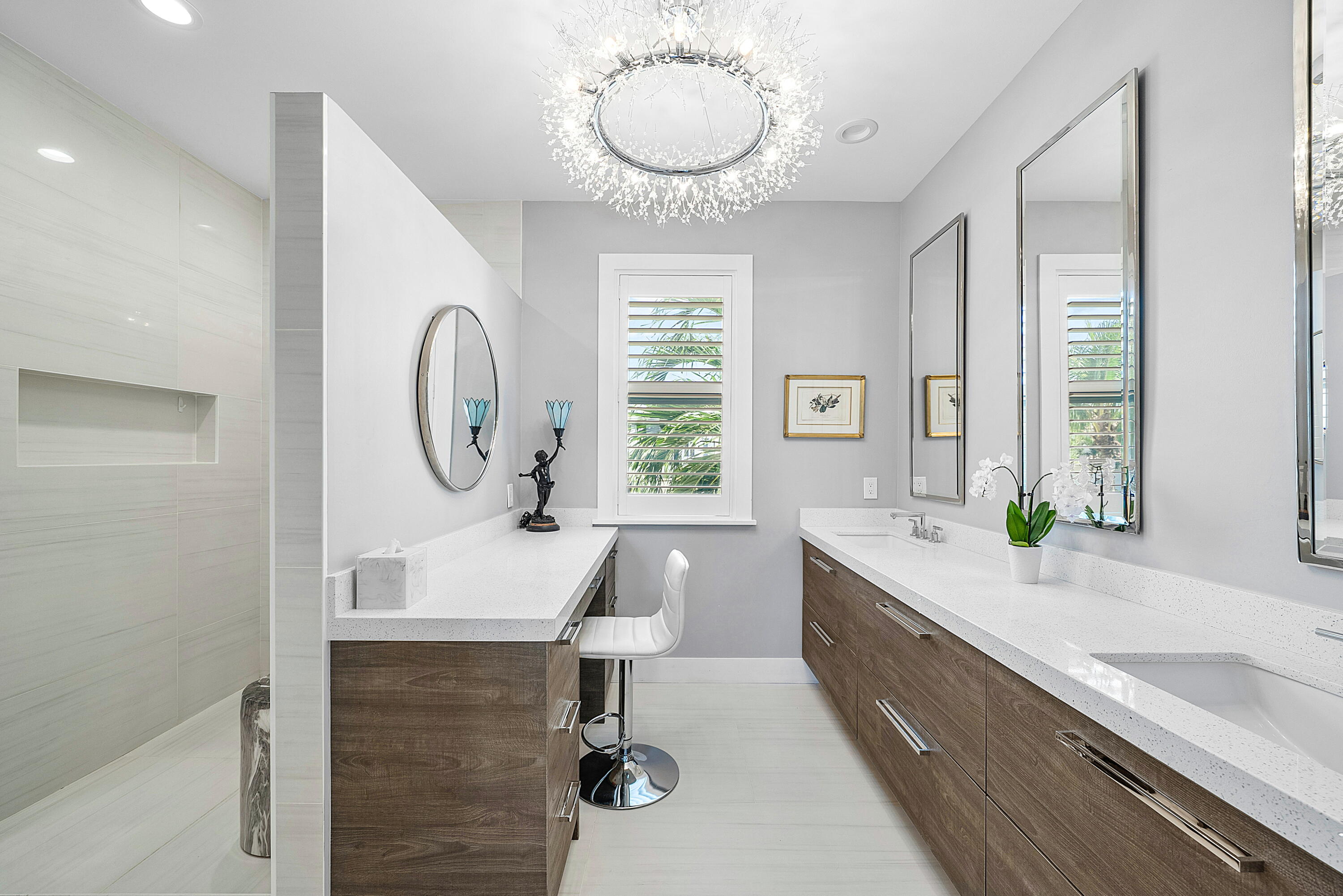 540 Northeast Spanish Trail Boca Raton, FL 33432 - Photo 26 of 47 a bathroom with a double vanity sink and a mirror