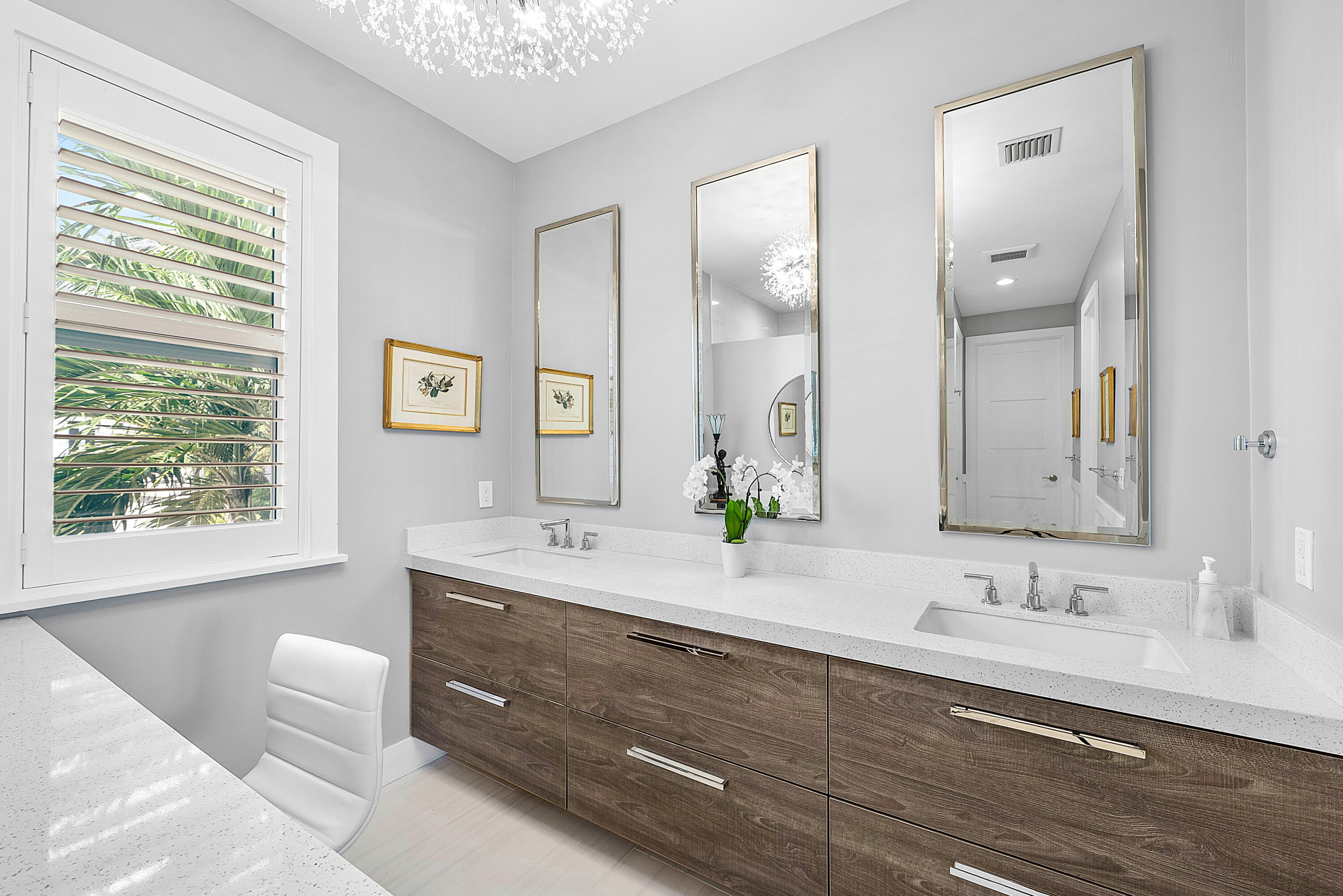 540 Northeast Spanish Trail Boca Raton, FL 33432 - Photo 27 of 47 a en suite bathroom with a granite countertop sink mirror and window