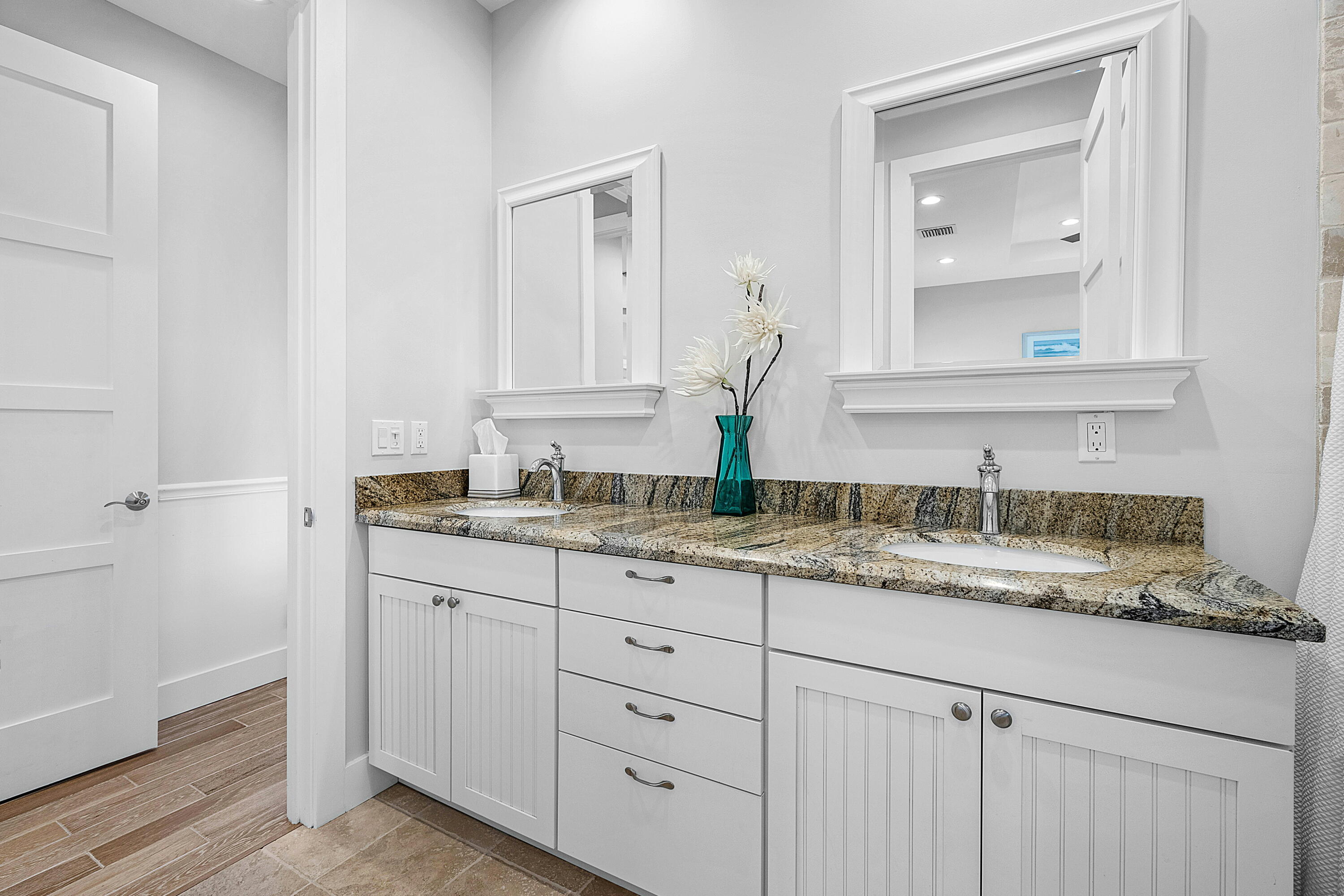 540 Northeast Spanish Trail Boca Raton, FL 33432 - Photo 32 of 47 a bathroom with a granite countertop sink mirror and vanity