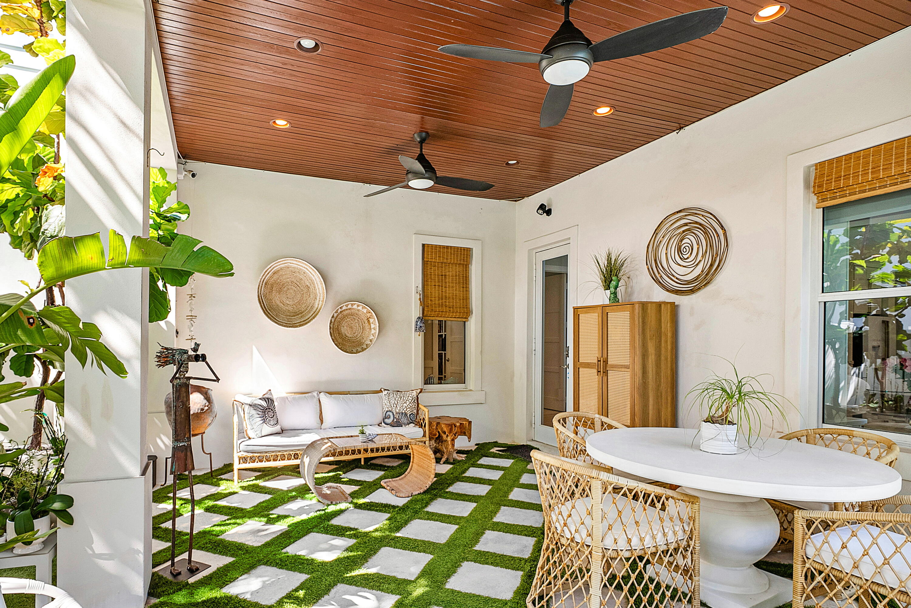 540 Northeast Spanish Trail Boca Raton, FL 33432 - Photo 38 of 47 a living room with a table chairs and a clock