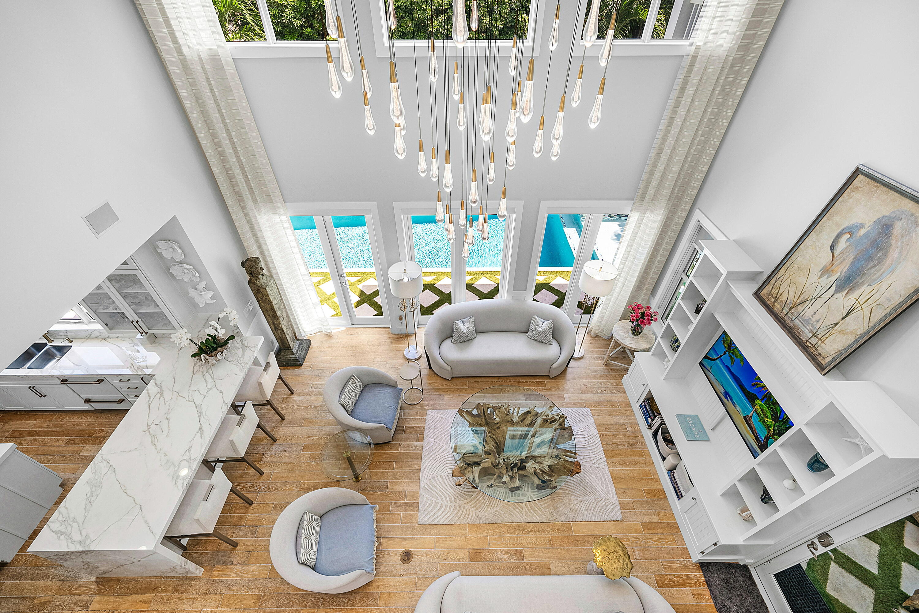 540 Northeast Spanish Trail Boca Raton, FL 33432 - Photo 10 of 47 a living room with furniture and a chandelier