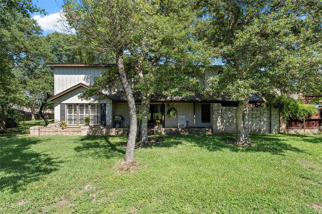 3907 Old Mill Road Waco, TX 76710 - Photo 25 of 30 a front view of house with a garden