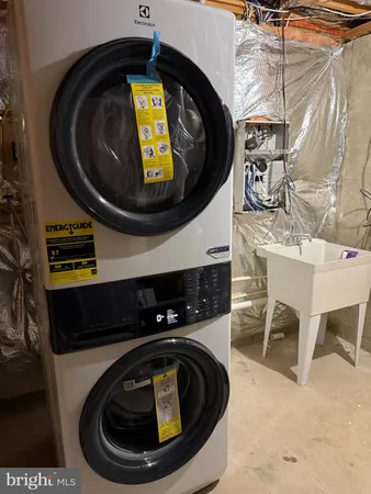 a close view of a fireplace and a washing machine in a bathroom