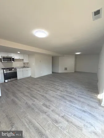 a view of a kitchen with a sink
