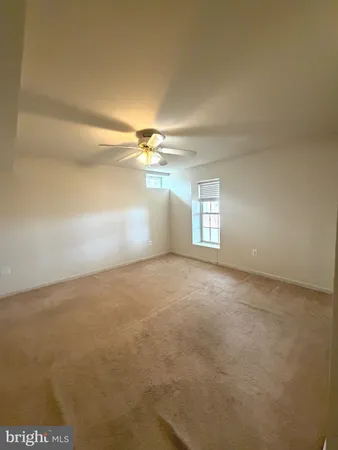 an empty room with a empty space and a window