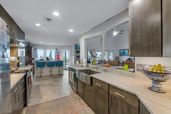 a kitchen with lots of counter top space and living room
