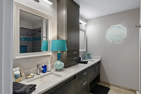 a bathroom with a sink and a mirror