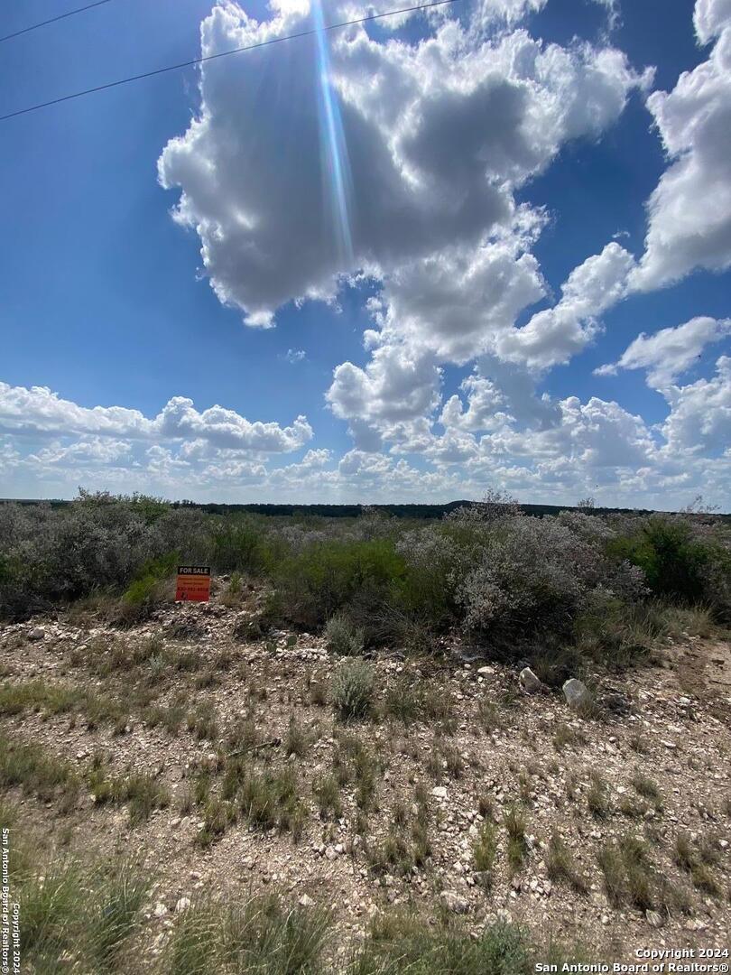 105 Legend Hills Uvalde, TX 78801 - Photo 4 of 5 a view of a lake in middle of forest