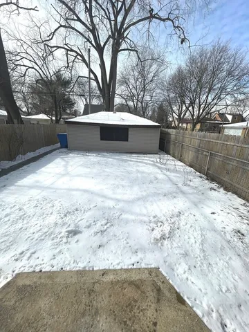a view of backyard space with large trees
