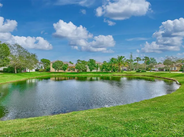 a view of swimming pool with a yard