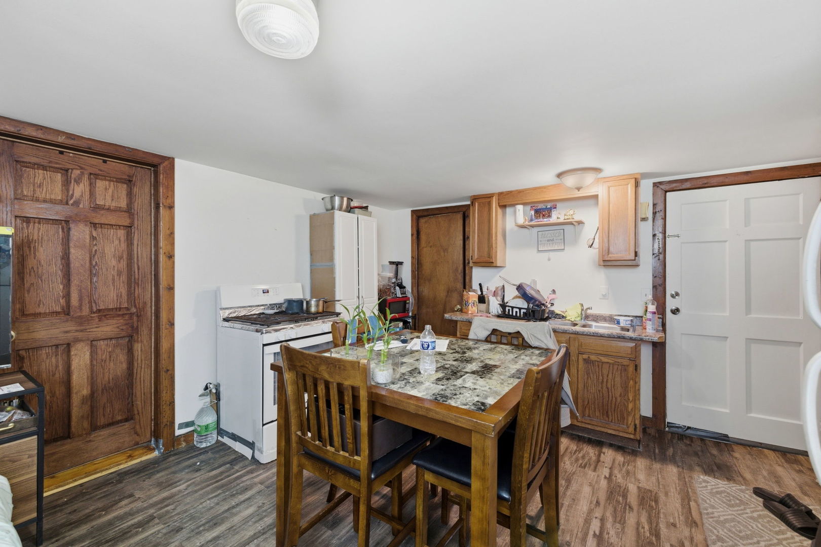 1709 South State Street Lockport, IL 60441 - Photo 11 of 26 a view of a kitchen with a table and chairs
