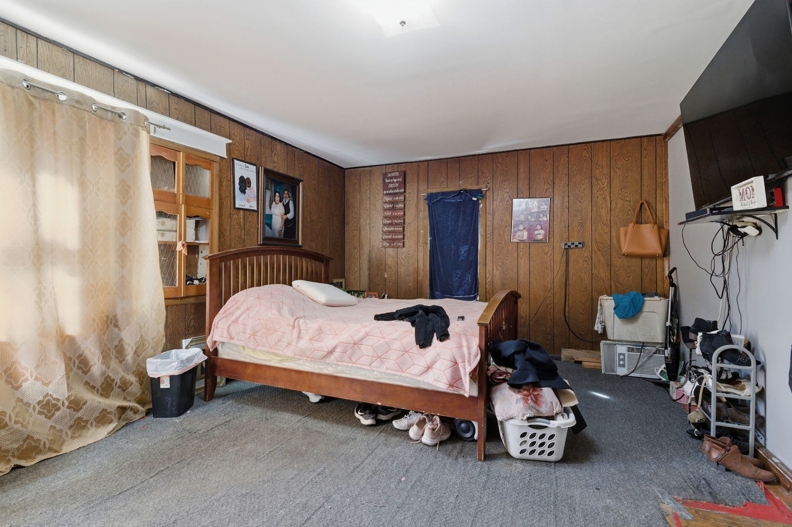 1709 South State Street Lockport, IL 60441 - Photo 16 of 26 a bed room with a bed and a chair