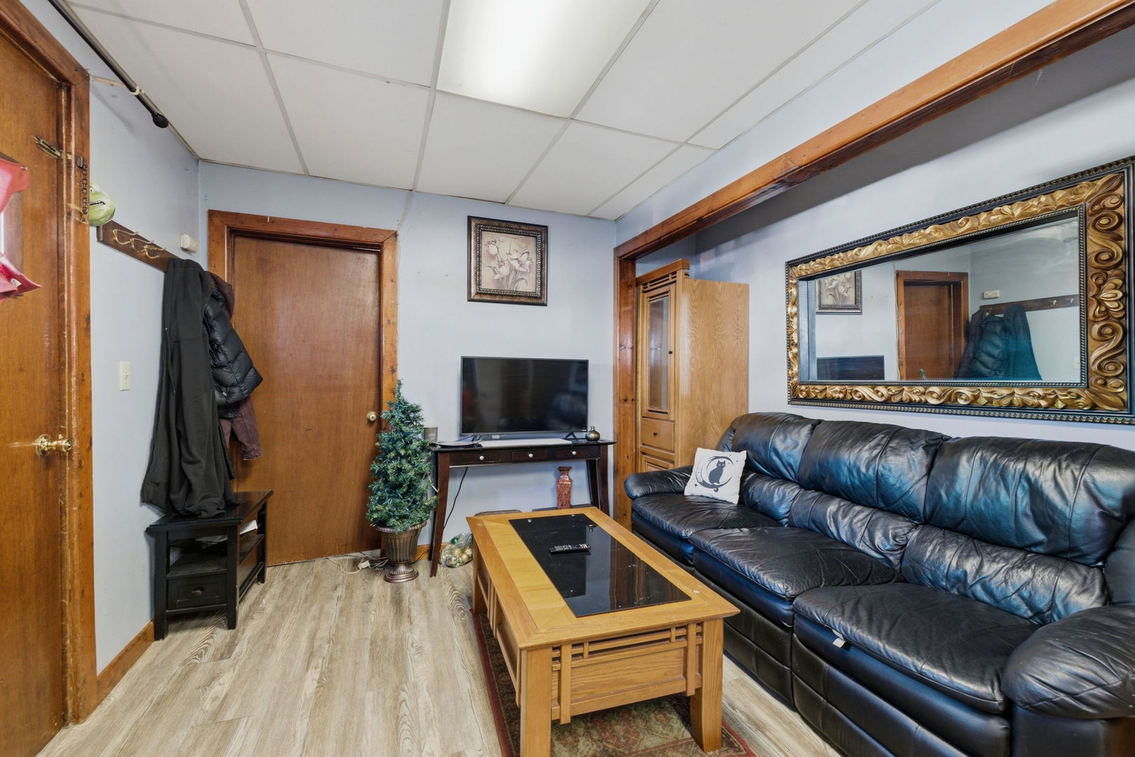 1709 South State Street Lockport, IL 60441 - Photo 3 of 26 a living room with furniture and a flat screen tv