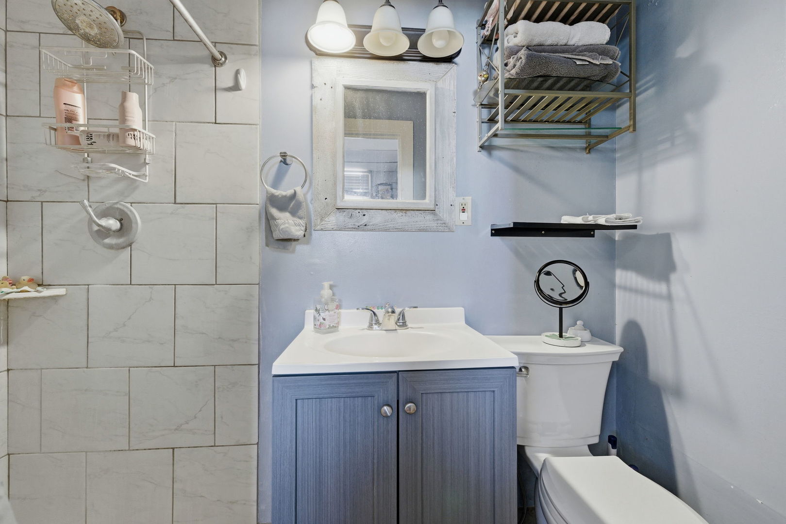 1709 South State Street Lockport, IL 60441 - Photo 5 of 26 a bathroom with a sink a toilet and mirror