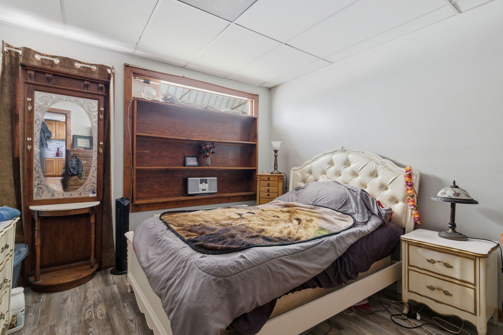 1709 South State Street Lockport, IL 60441 - Photo 6 of 26 a bed sitting in a bedroom next to a window