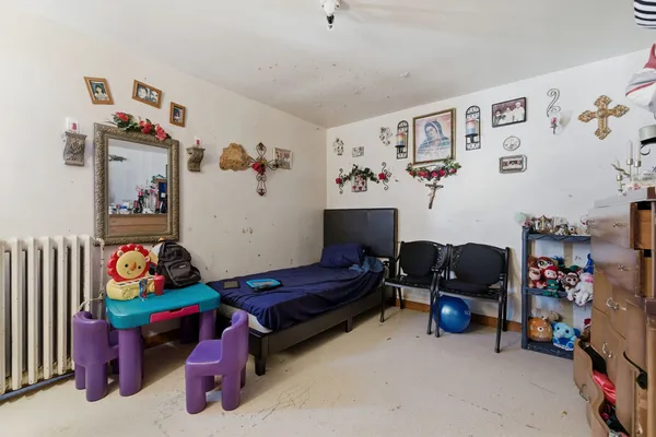 a bedroom with toys and a couch