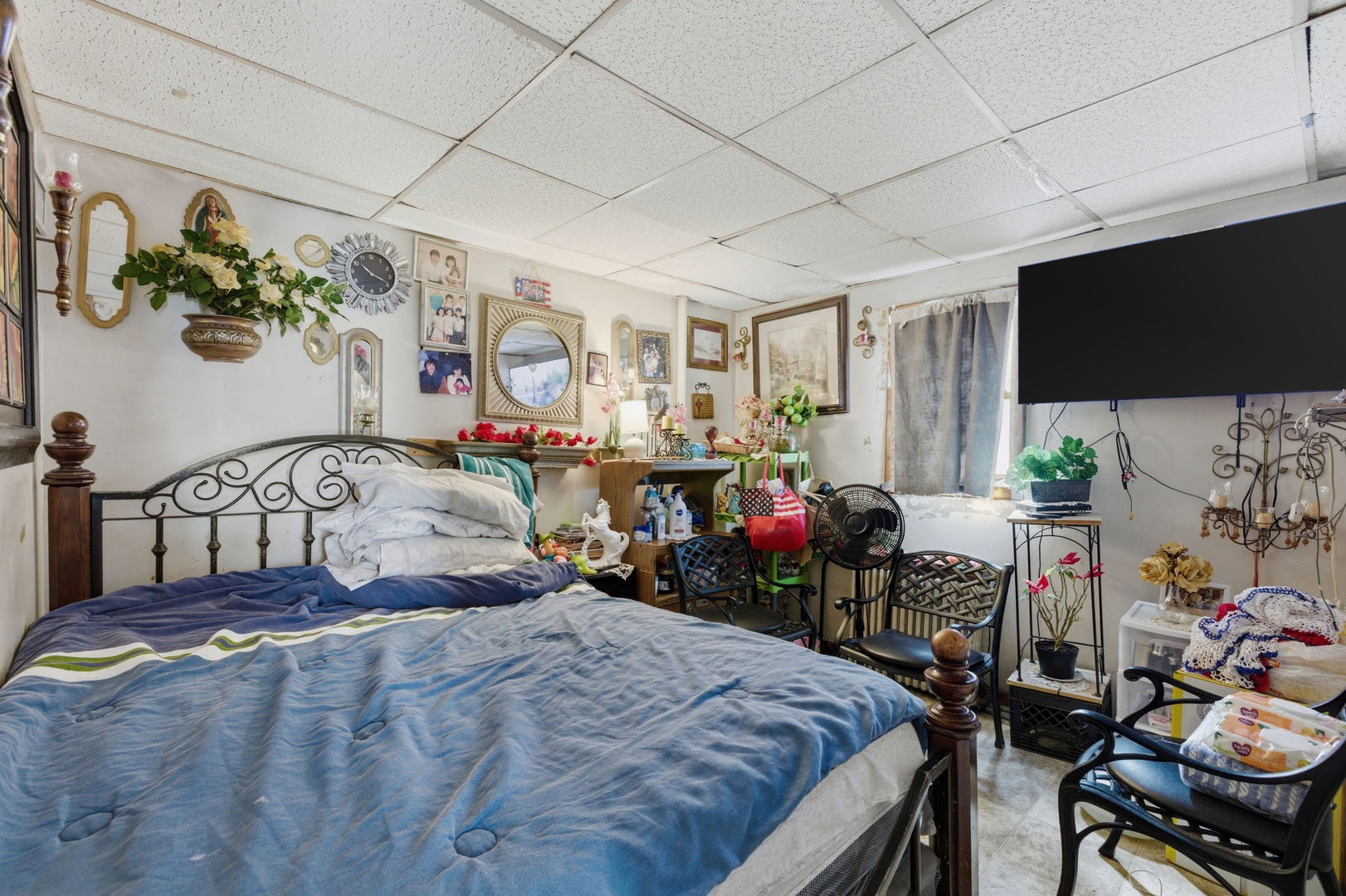 1709 South State Street Lockport, IL 60441 - Photo 9 of 26 a bedroom with furniture and a flat screen tv