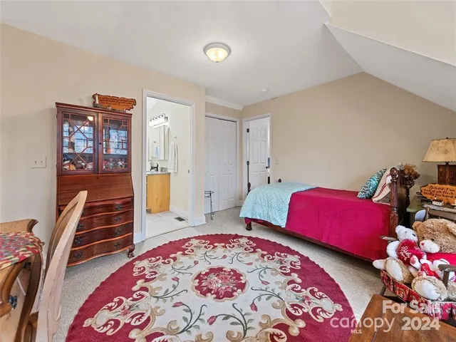 a bedroom with a bed and furniture