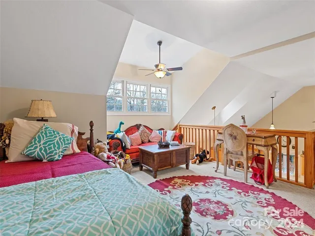 a bedroom with bed and window