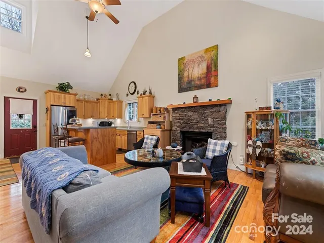 a living room with furniture fireplace and rug