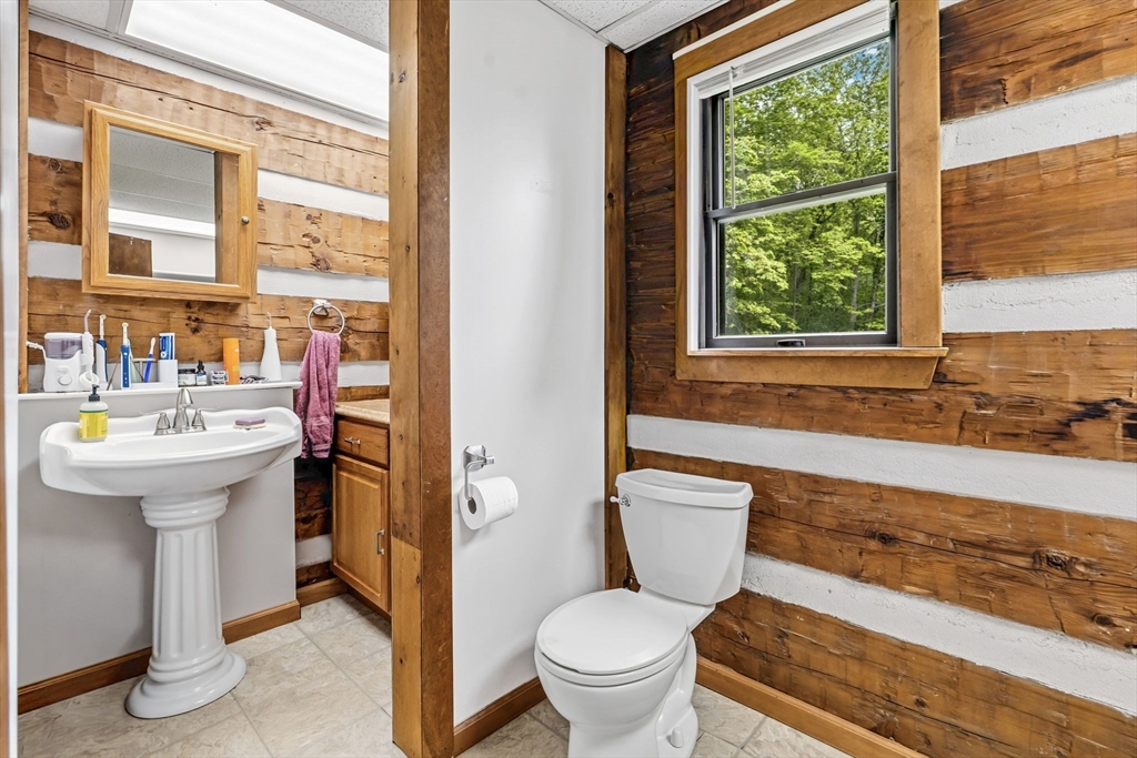 22 Lyon Hill Road Chester, MA 01011 - Photo 22 of 38 a bathroom with a sink toilet and shower