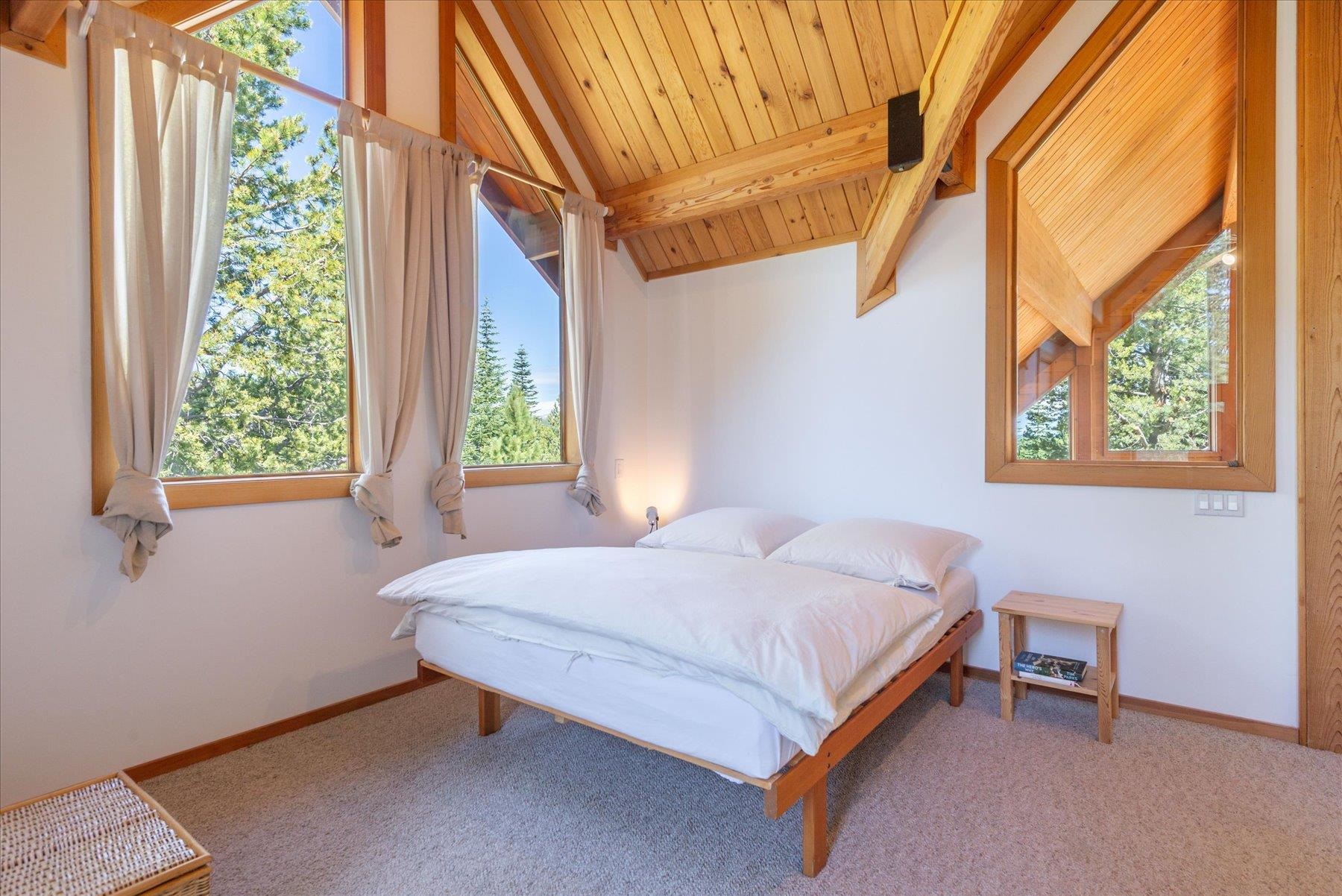 15009 Ski Slope Way Truckee, CA 96161 - Photo 11 of 28 a bedroom with a bed and a window