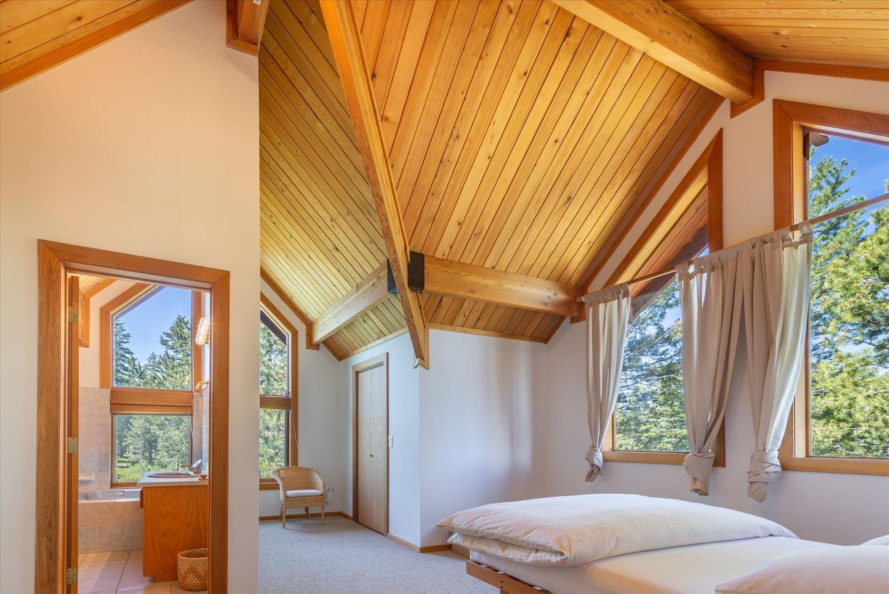 15009 Ski Slope Way Truckee, CA 96161 - Photo 12 of 28 a bedroom with a bed and a window