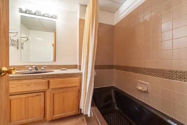 a living room with furniture and large windows