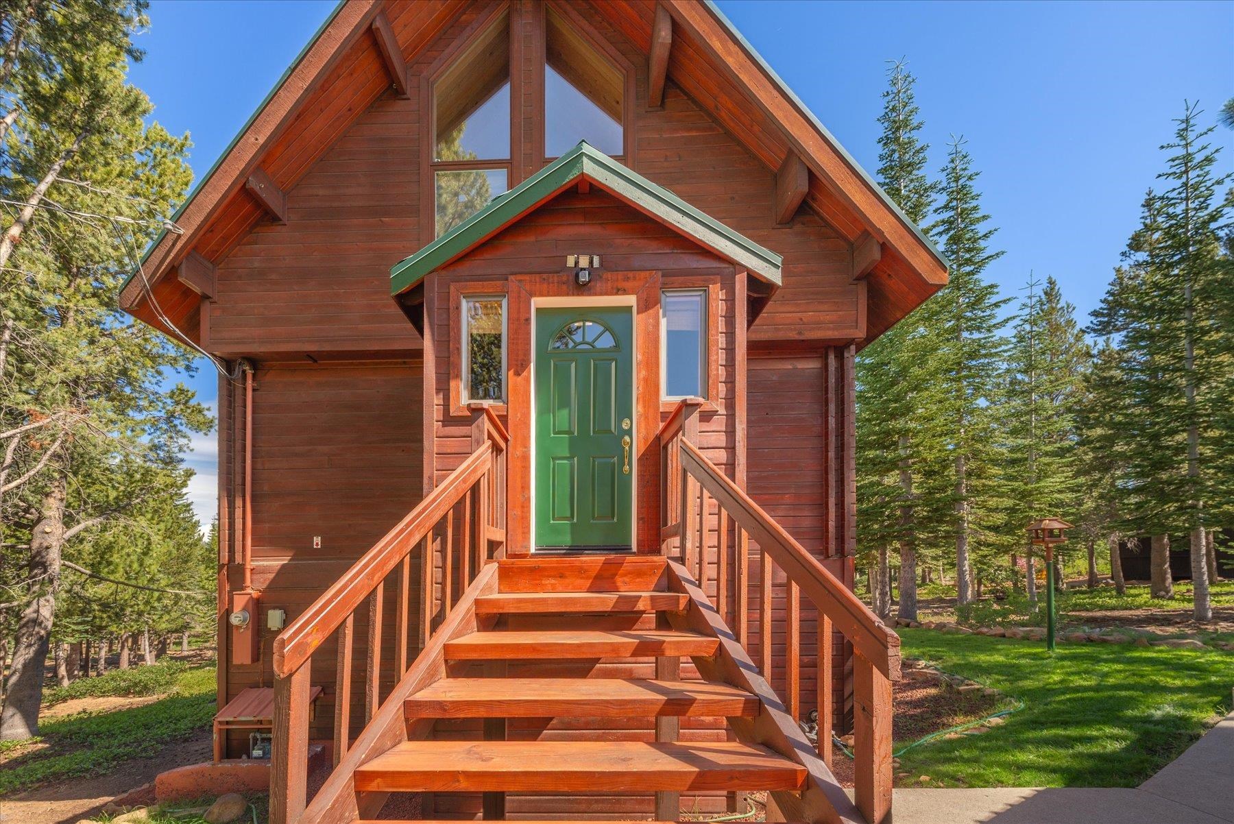 15009 Ski Slope Way Truckee, CA 96161 - Photo 4 of 28 a view of a house with large windows and a white roof