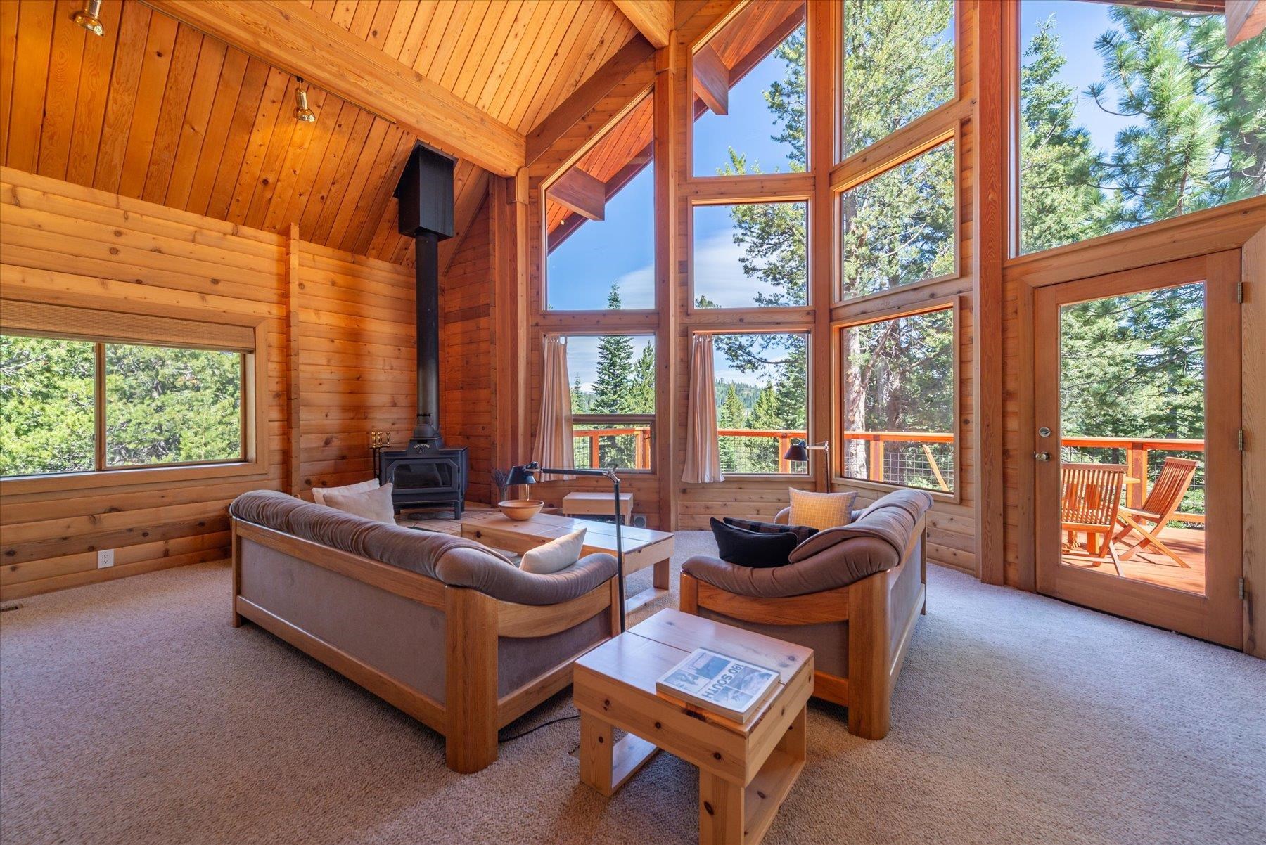 15009 Ski Slope Way Truckee, CA 96161 - Photo 9 of 28 a living room with furniture and a floor to ceiling window