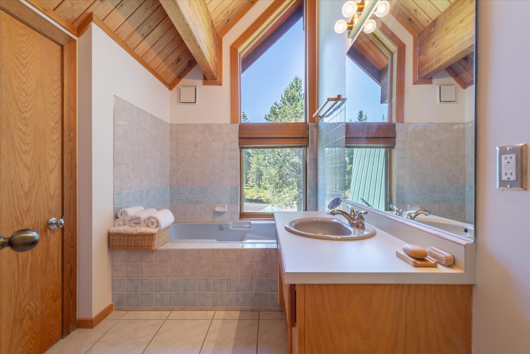 15009 Ski Slope Way Truckee, CA 96161 - Photo 10 of 28 a bathroom with a sink and a bathtub