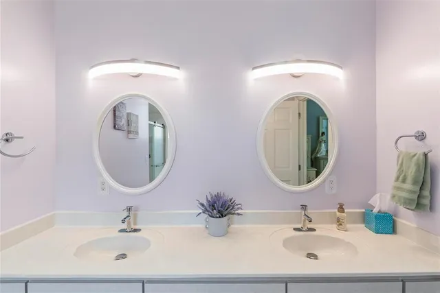 a view of a patio with a table and chairs under an umbrella